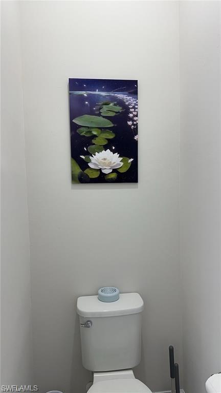 7135 Cayo Coco Lane Naples, FL 34113 - Photo 19 of 41 Bathroom featuring toilet