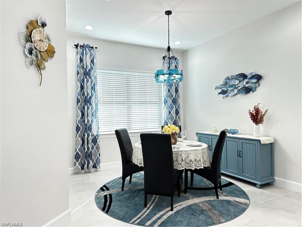 7135 Cayo Coco Lane Naples, FL 34113 - Photo 2 of 41 Dining room with light tile patterned flooring and recessed lighting