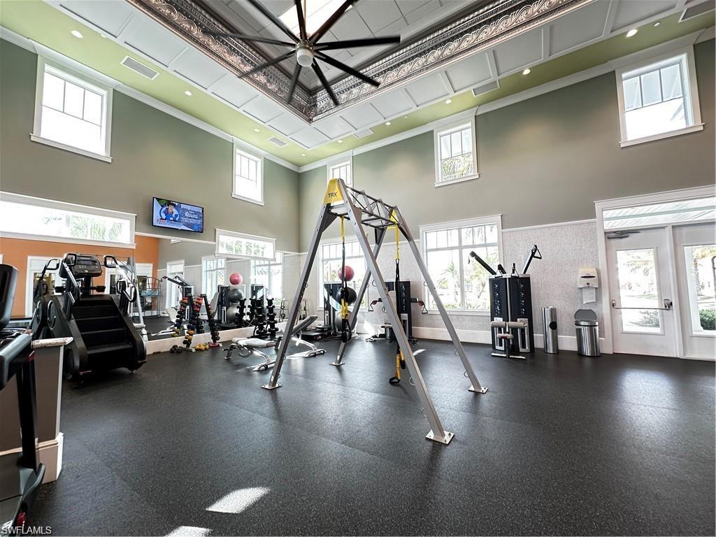7135 Cayo Coco Lane Naples, FL 34113 - Photo 35 of 41 Workout area with a high ceiling and a ceiling fan