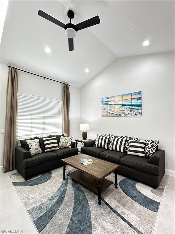7135 Cayo Coco Lane Naples, FL 34113 - Photo 5 of 41 Living area featuring ceiling fan, lofted ceiling, and recessed lighting