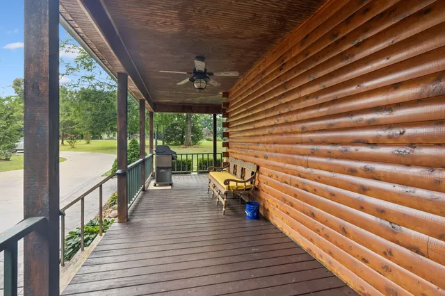 a view of a porch with wooden floor