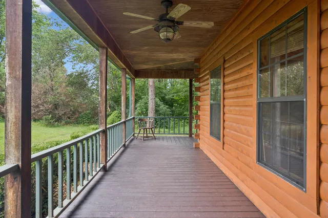 a view of a porch with wooden floor