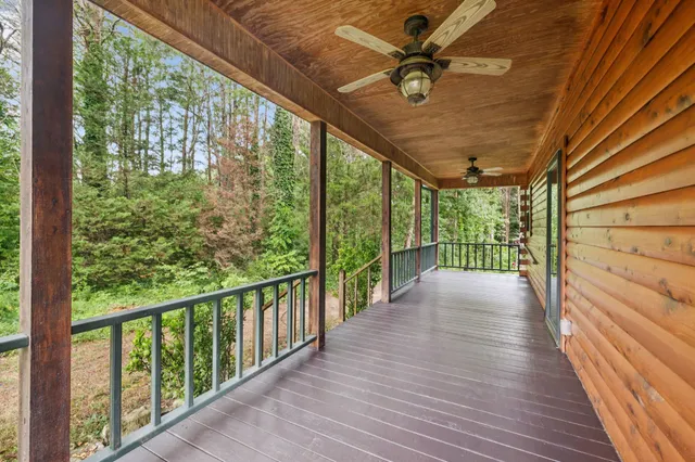 a view of a balcony with wooden floor