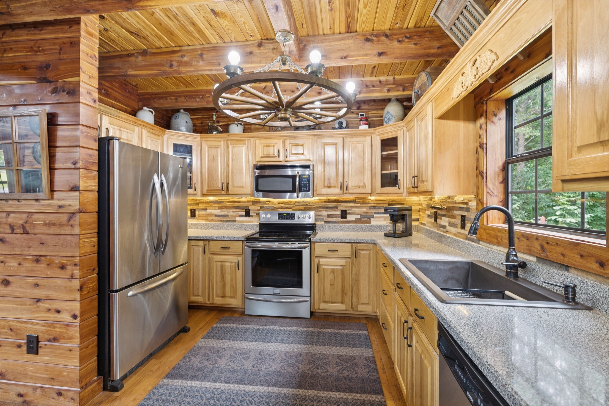 602 Gaither Hinson Road Waynesboro, TN 38485 - Photo 24 of 69 a kitchen with stainless steel appliances granite countertop a sink a stove and a refrigerator