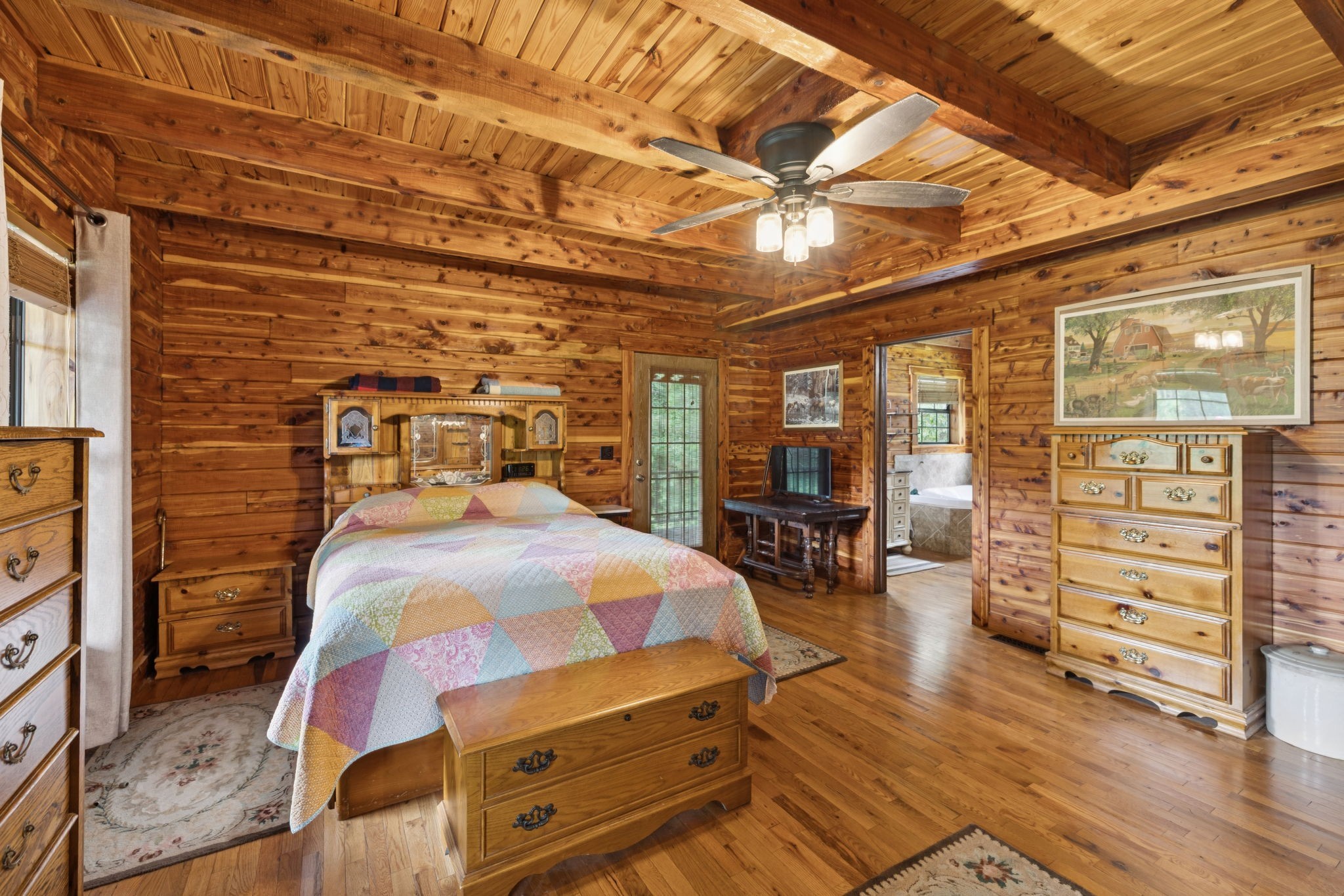 602 Gaither Hinson Road Waynesboro, TN 38485 - Photo 31 of 69 a bedroom with a bed and wooden floor