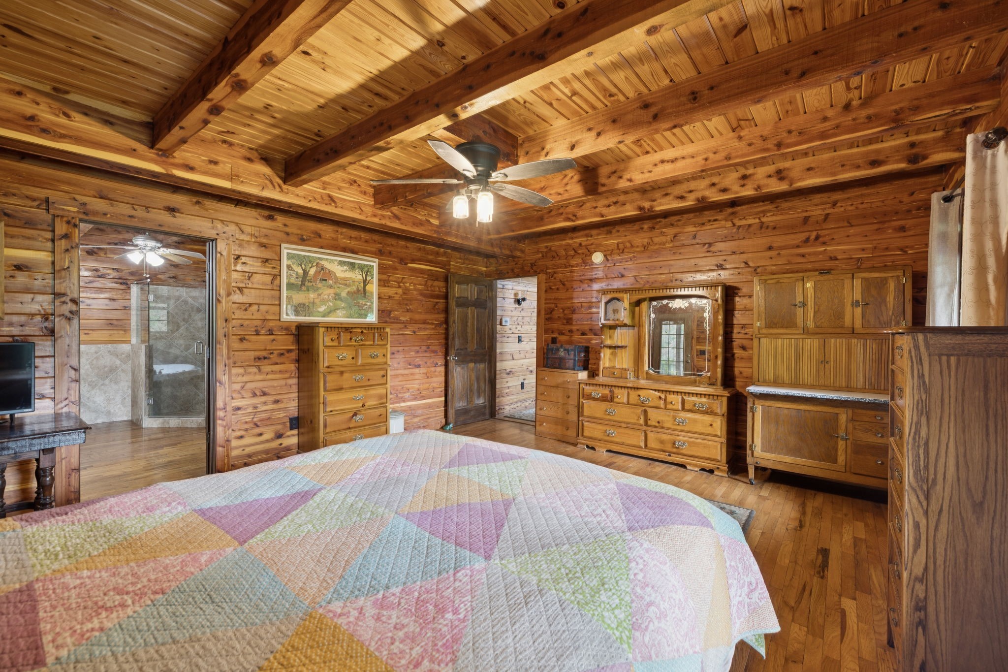 602 Gaither Hinson Road Waynesboro, TN 38485 - Photo 32 of 69 a bed sitting in a bedroom next to a window