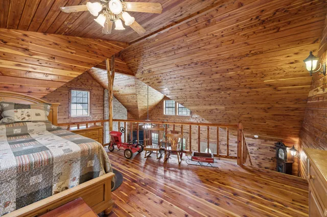 an aerial view of a house with swimming pool and patio