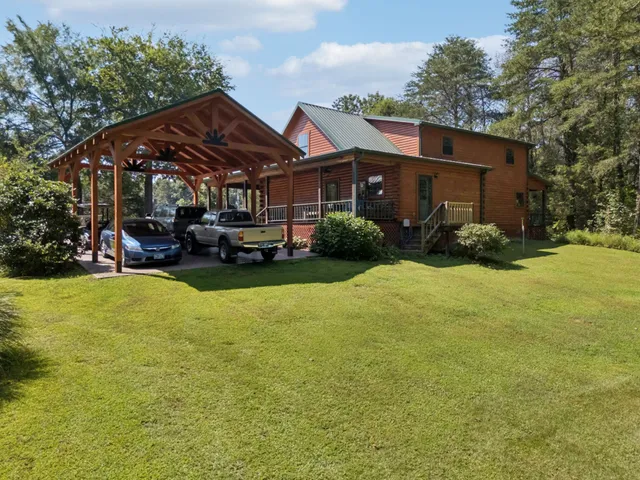 a view of a house with a yard