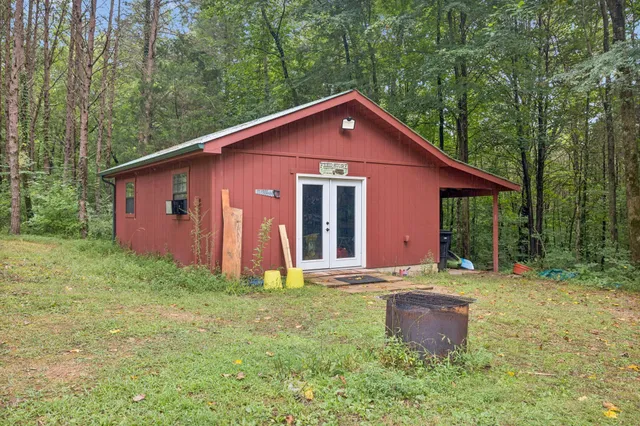 an aerial view of a house with a yard