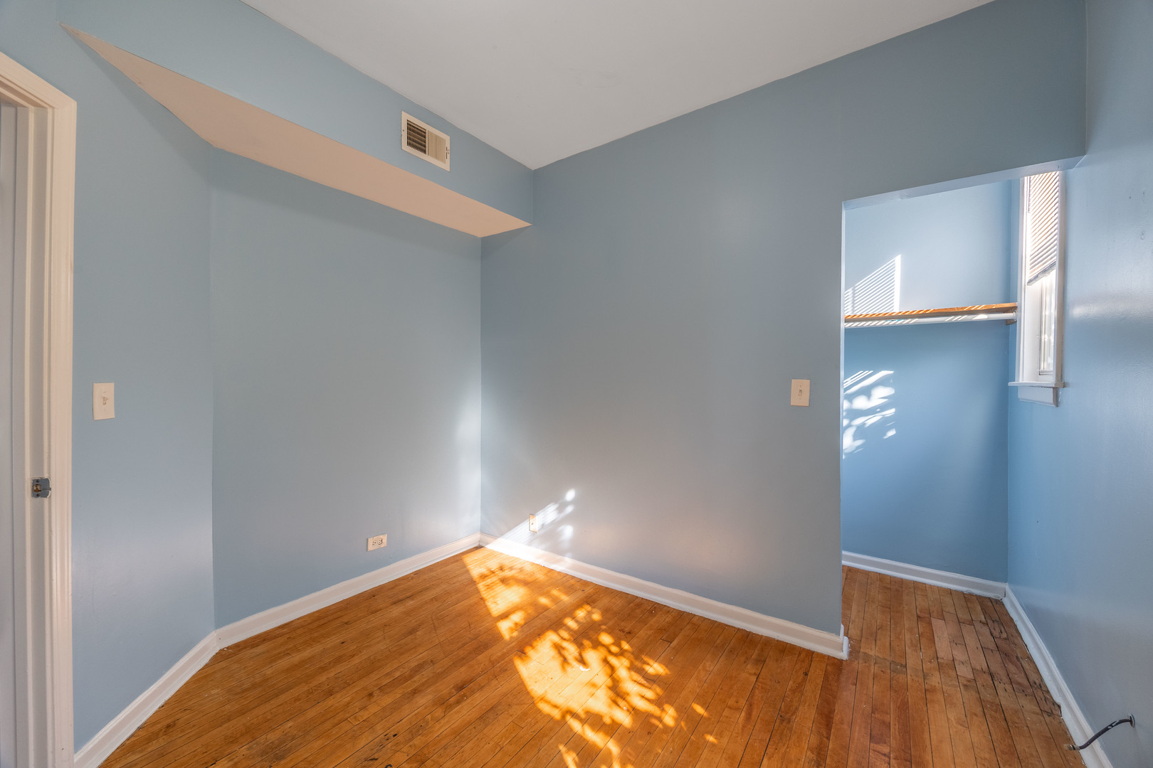 4058 West Congress Parkway, Unit 2S Chicago, IL 60624 - Photo 11 of 13 a view of a room with wooden floor