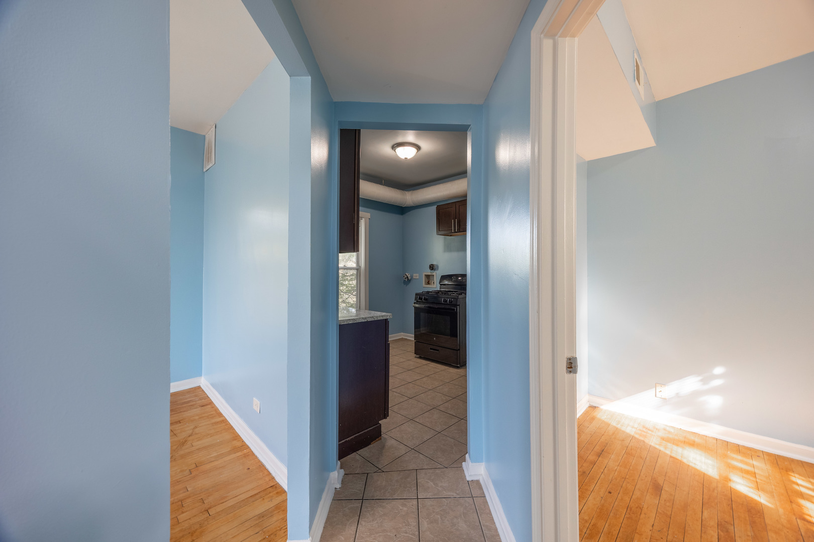 4058 West Congress Parkway, Unit 2S Chicago, IL 60624 - Photo 8 of 13 a view of a elevator and an entryway in a hallway