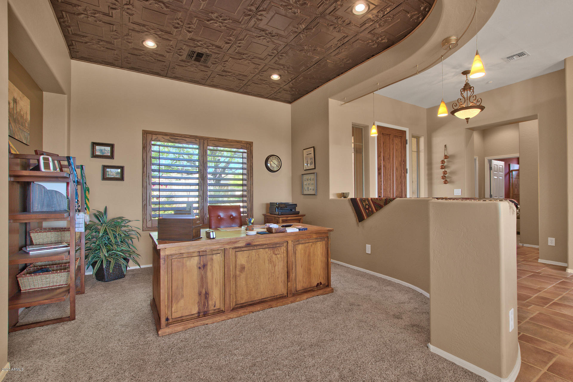 42045 North Crooked Stick Road Anthem, AZ 85086 - Photo 11 of 37 a room with furniture a window and a flat screen tv