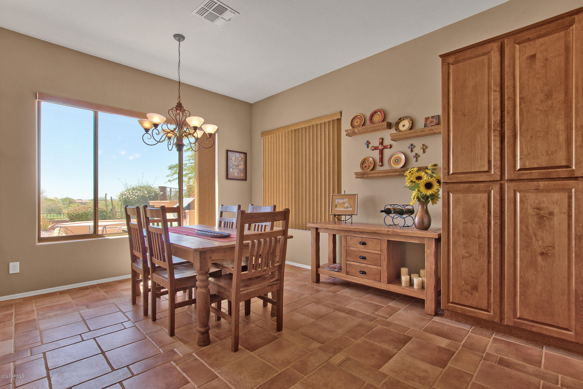 42045 North Crooked Stick Road Anthem, AZ 85086 - Photo 12 of 37 a view of a dining room with furniture window and outside view