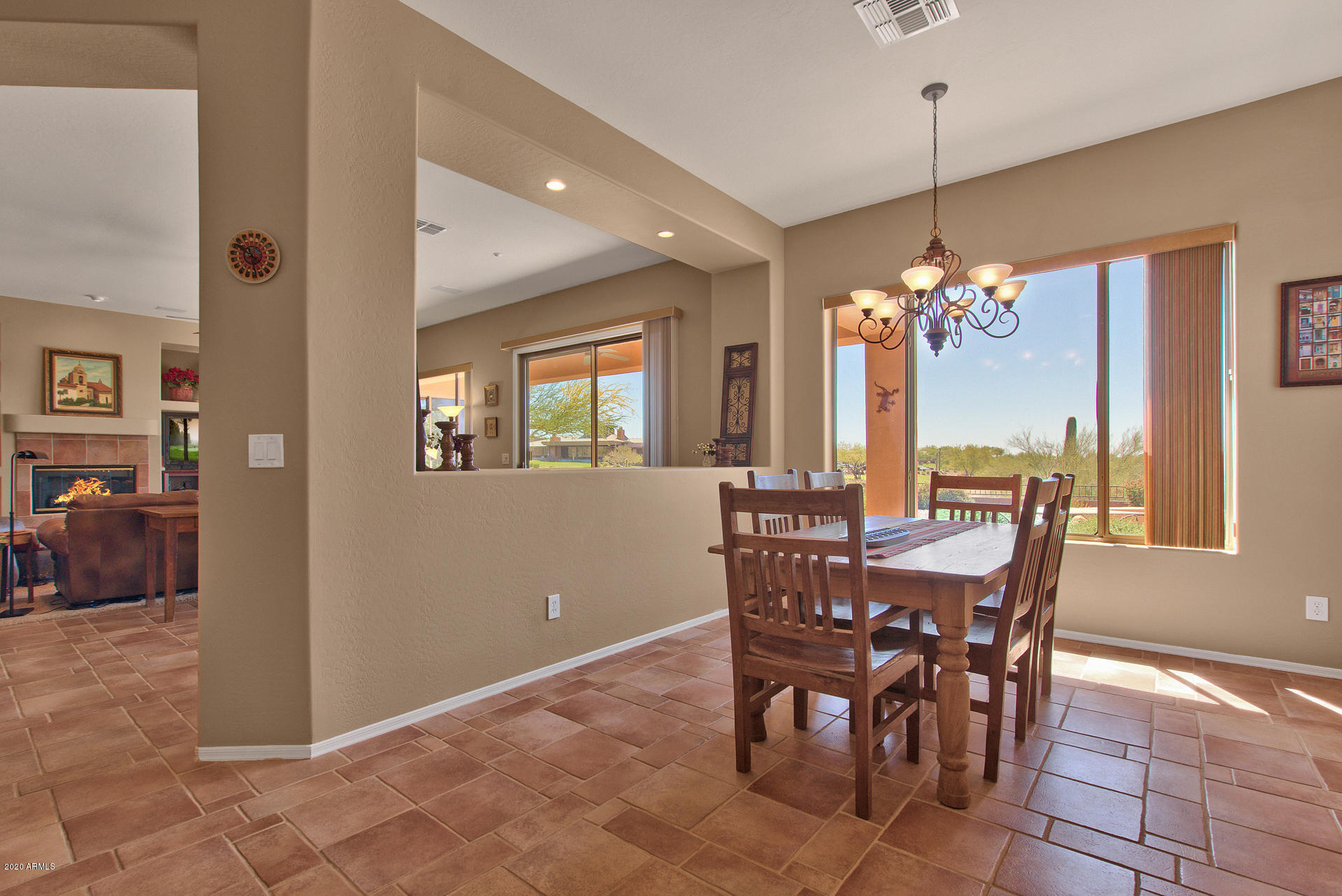 42045 North Crooked Stick Road Anthem, AZ 85086 - Photo 13 of 37 a view of a dining room with furniture and chandelier