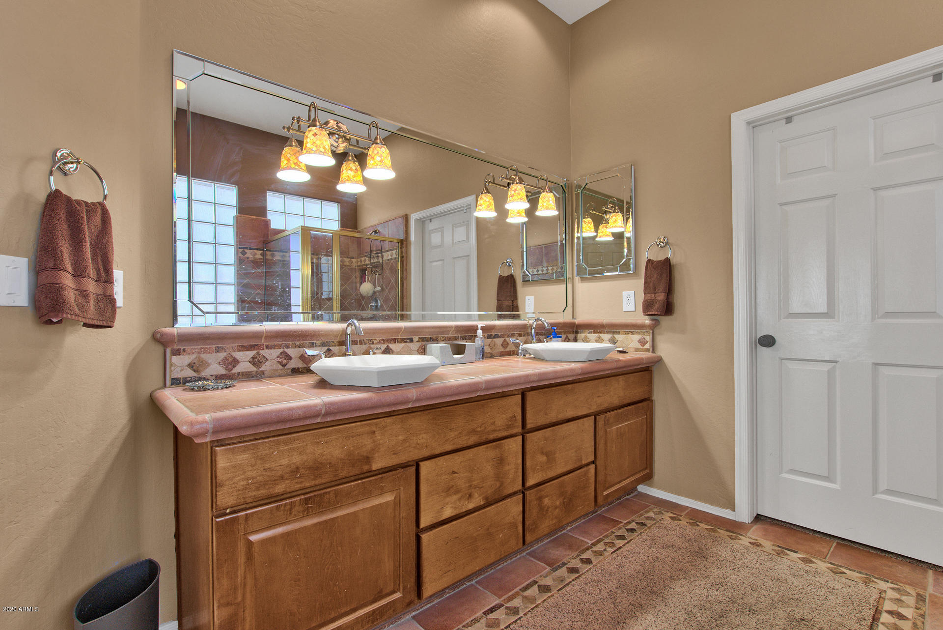 42045 North Crooked Stick Road Anthem, AZ 85086 - Photo 23 of 37 a bathroom with a double vanity sink and a mirror