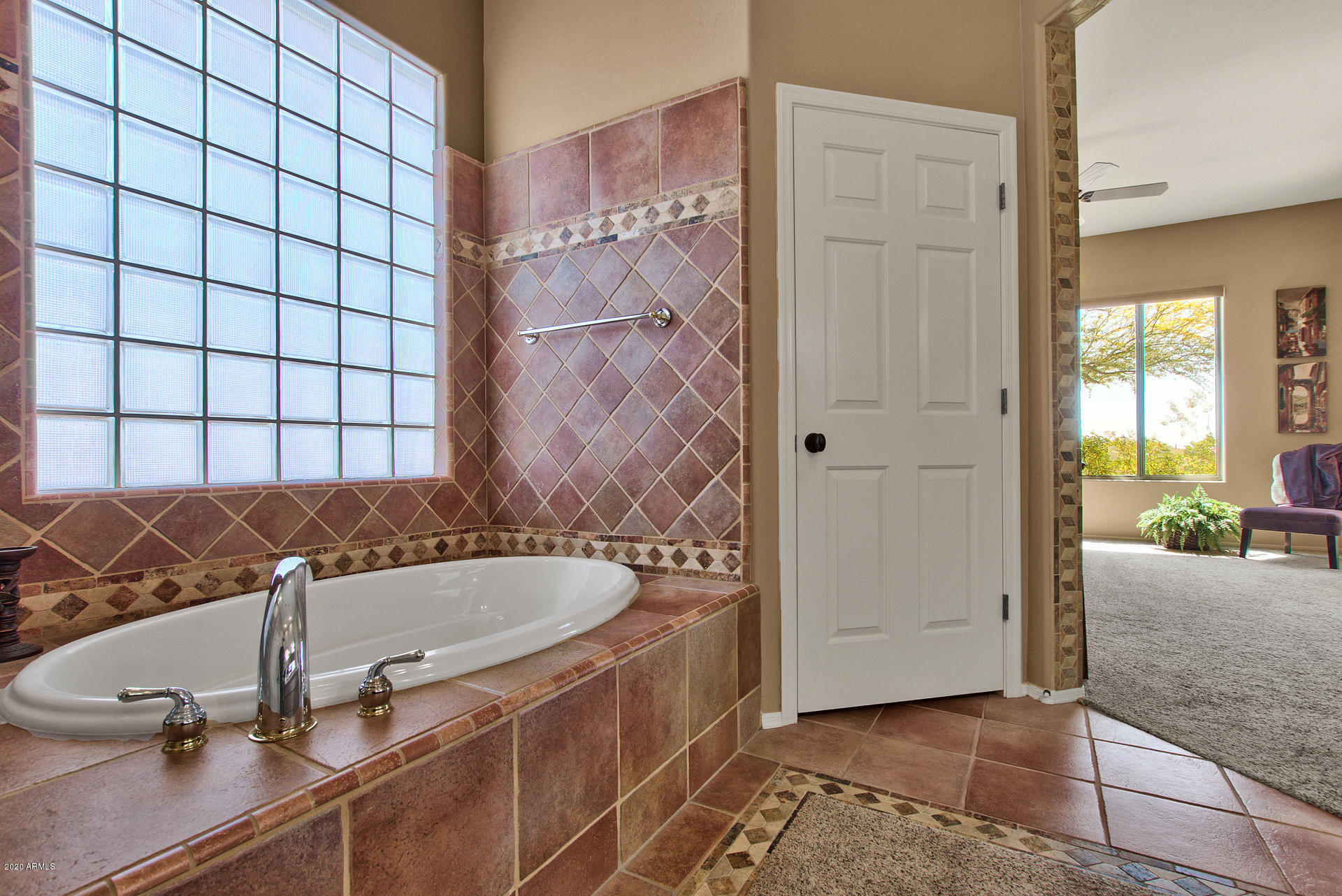 42045 North Crooked Stick Road Anthem, AZ 85086 - Photo 24 of 37 a bathroom with a tub and a shower