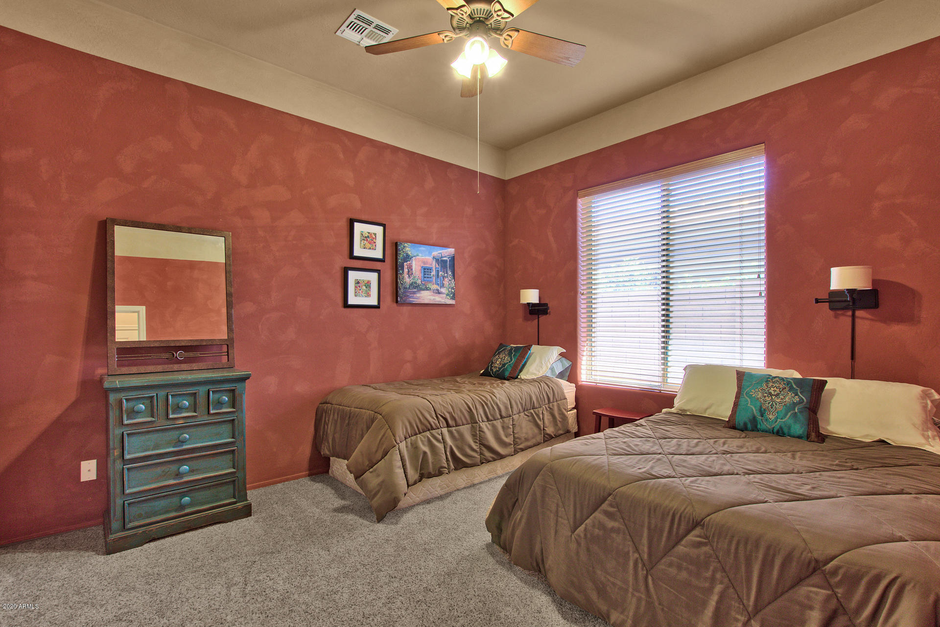 42045 North Crooked Stick Road Anthem, AZ 85086 - Photo 25 of 37 a bedroom with two beds and a chandelier