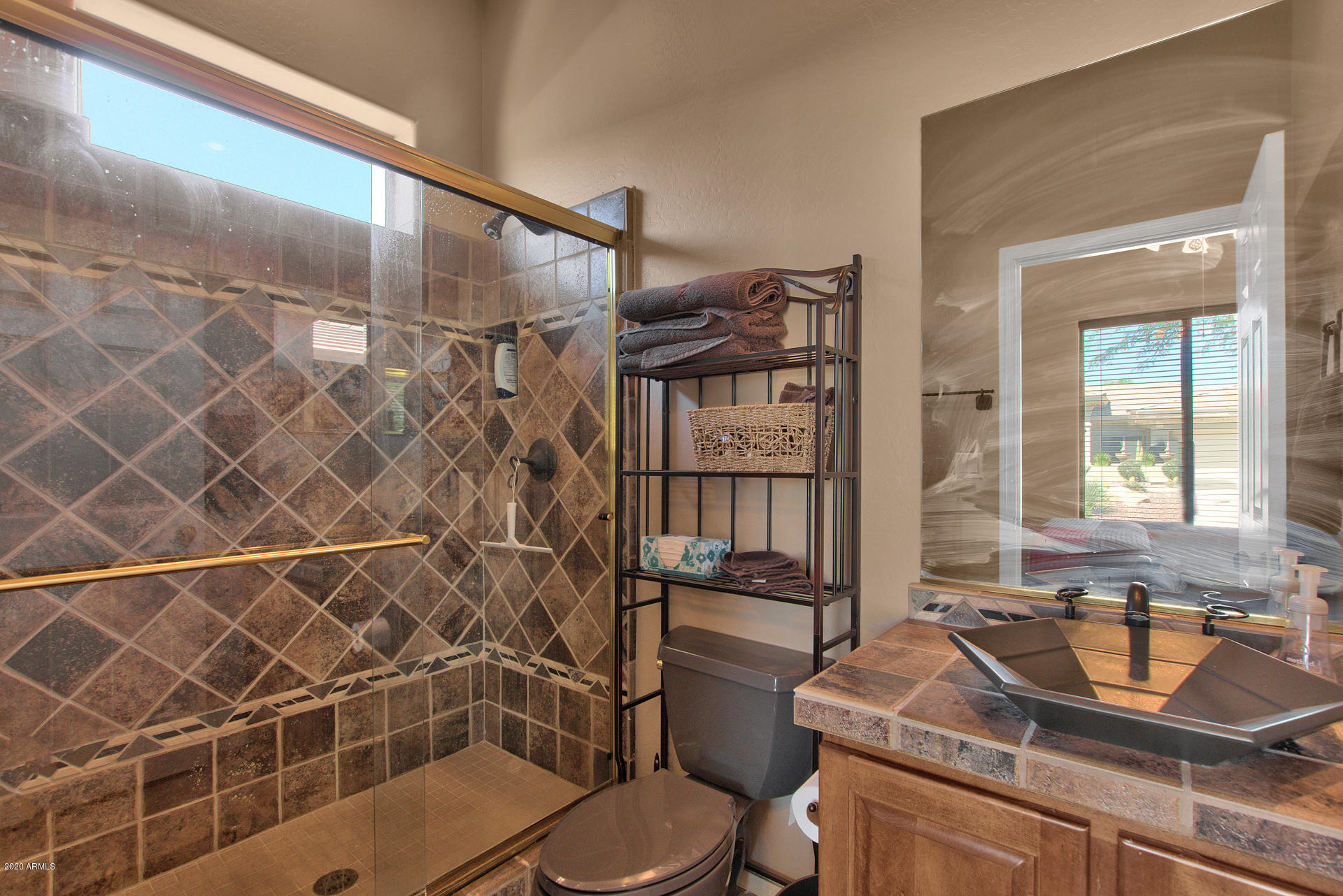 42045 North Crooked Stick Road Anthem, AZ 85086 - Photo 29 of 37 a bathroom with a sink toilet and shower