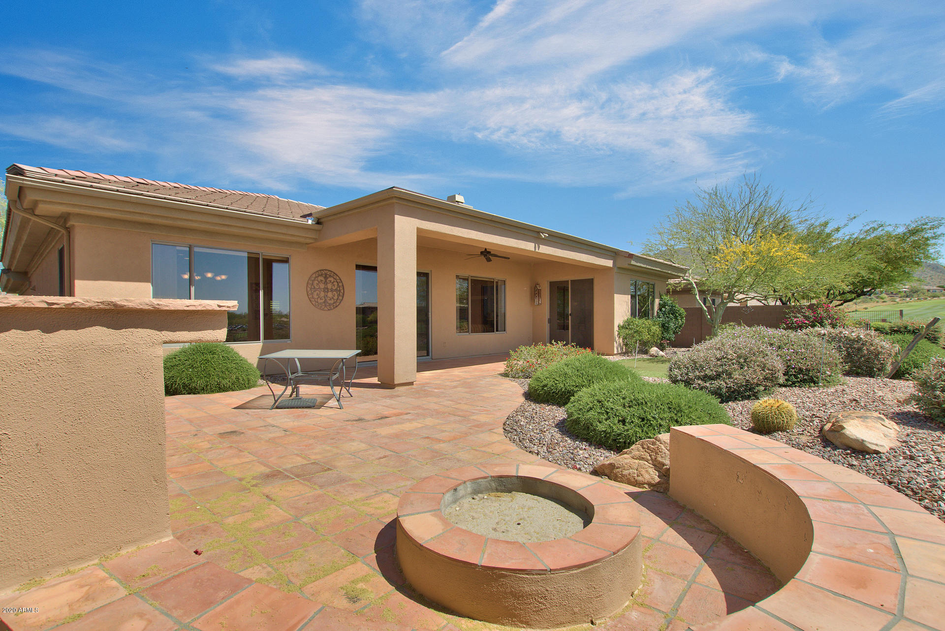 42045 North Crooked Stick Road Anthem, AZ 85086 - Photo 31 of 37 a view of a house with backyard and sitting area