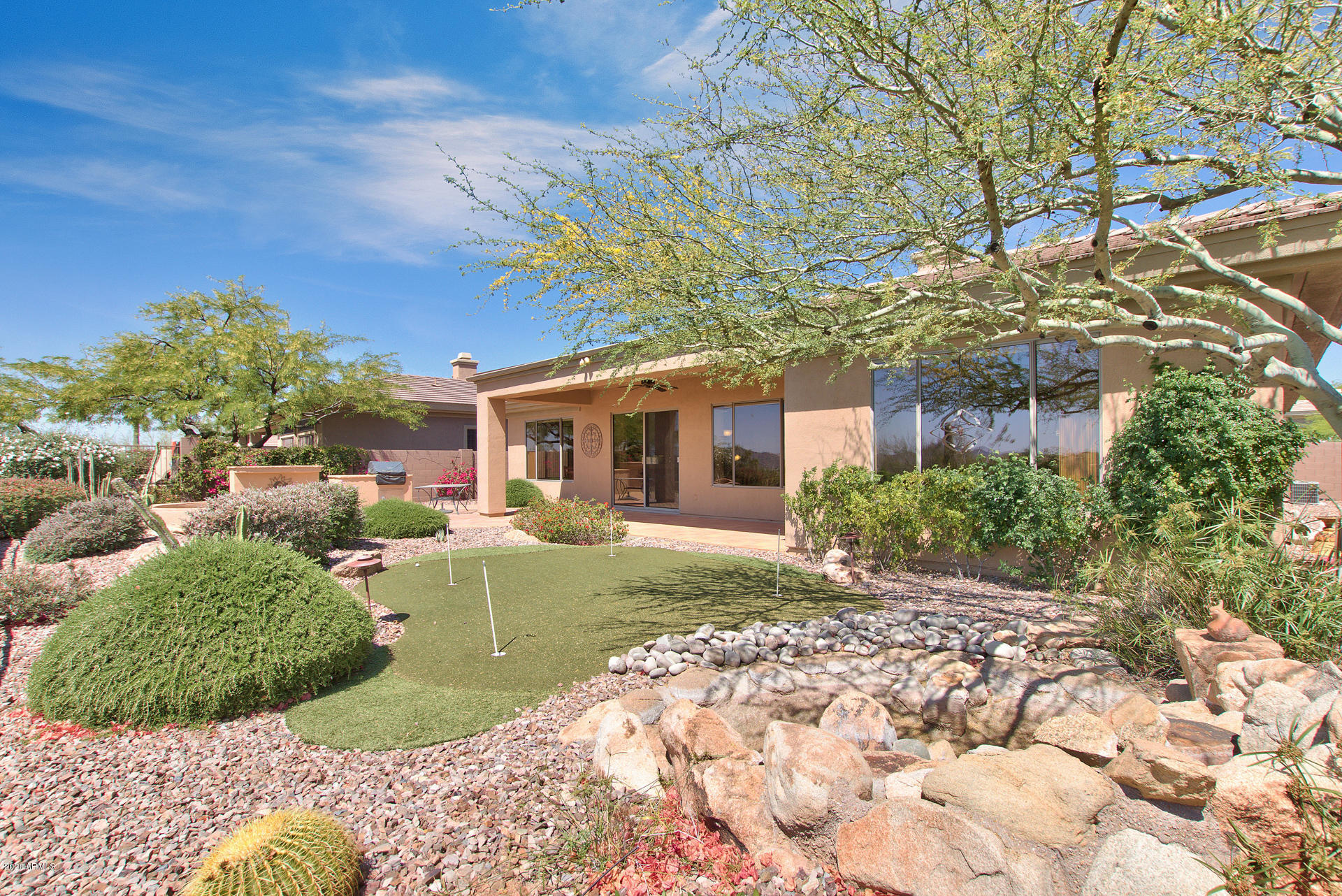 42045 North Crooked Stick Road Anthem, AZ 85086 - Photo 35 of 37 a view of a house with backyard and garden