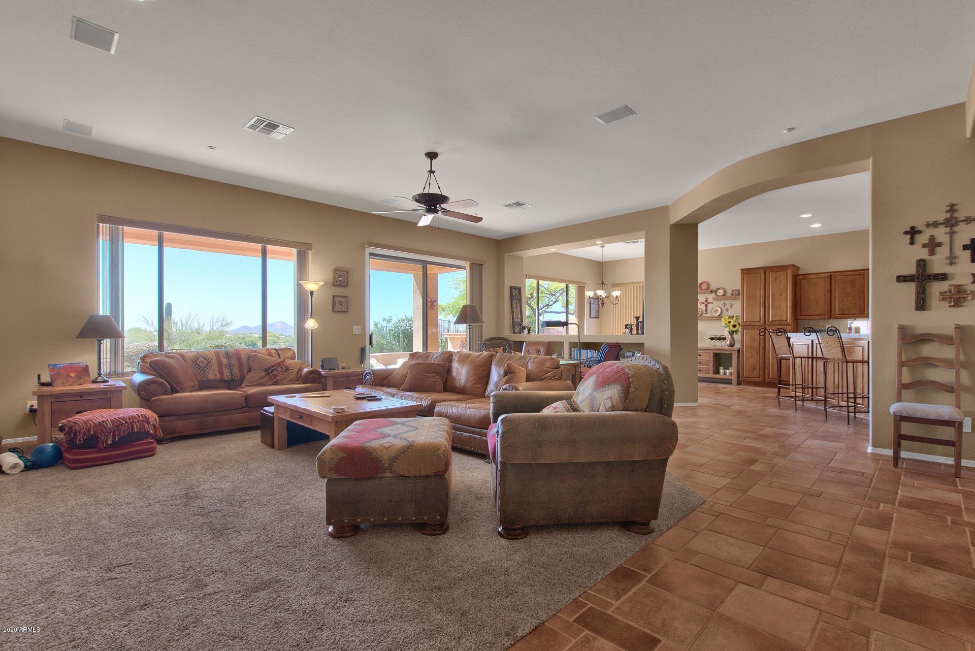 42045 North Crooked Stick Road Anthem, AZ 85086 - Photo 7 of 37 a living room with furniture and a large window