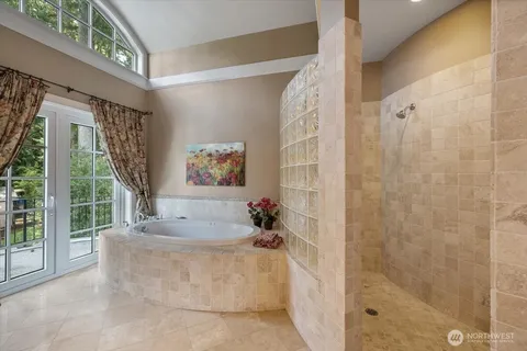 a living room with a bath tub and a shower