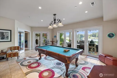 a room with furniture and pool table