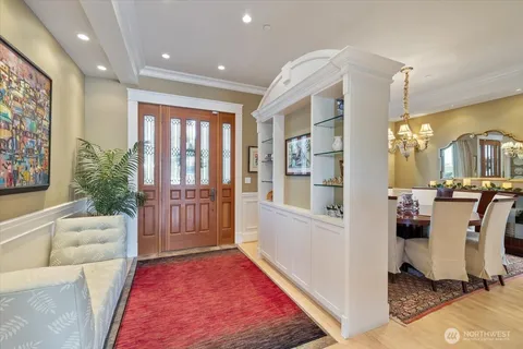 a living room with furniture rug and a table