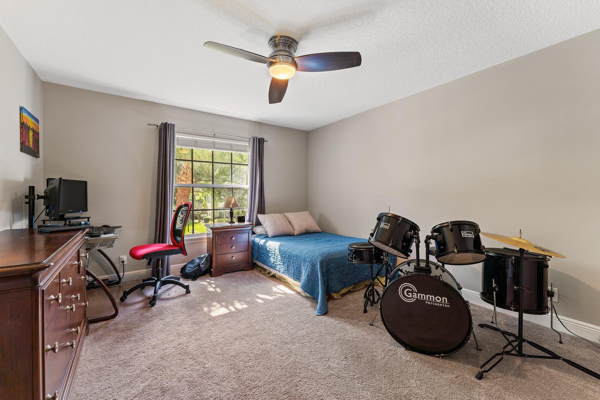 203 Anhinga Lane Jupiter, FL 33458 - Photo 35 of 63 a living room with furniture a flat screen tv and a window