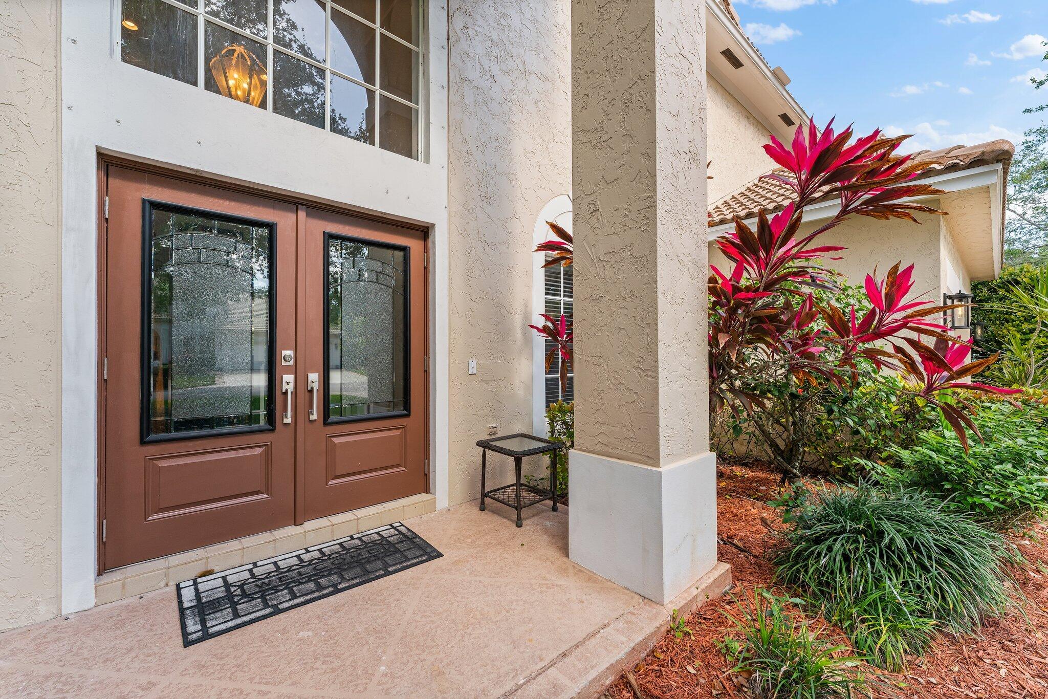 203 Anhinga Lane Jupiter, FL 33458 - Photo 4 of 63 a view of a entryway door of the house