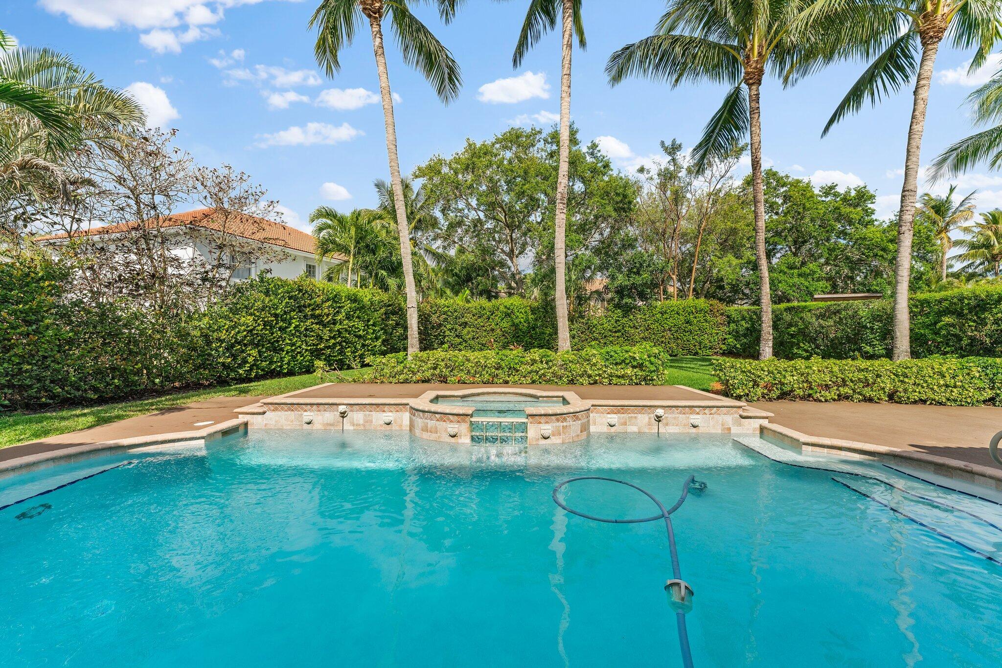 203 Anhinga Lane Jupiter, FL 33458 - Photo 45 of 63 a view of swimming pool with a table and chairs