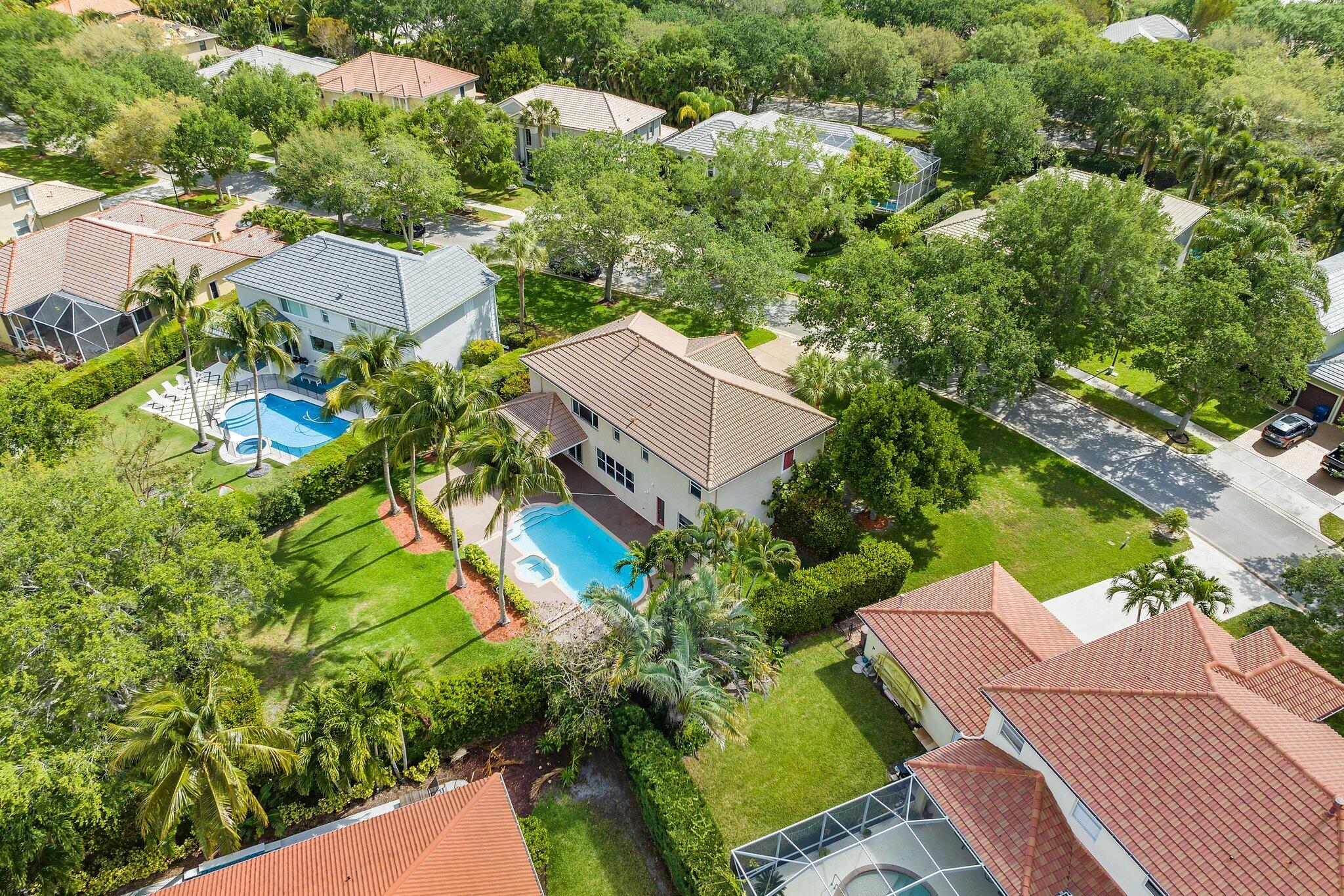 203 Anhinga Lane Jupiter, FL 33458 - Photo 5 of 63 an aerial view of a house with yard swimming pool and outdoor seating