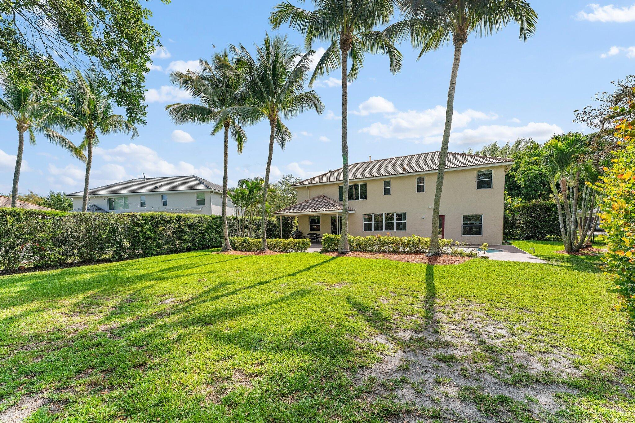 203 Anhinga Lane Jupiter, FL 33458 - Photo 53 of 63 a house with palm tree in the background