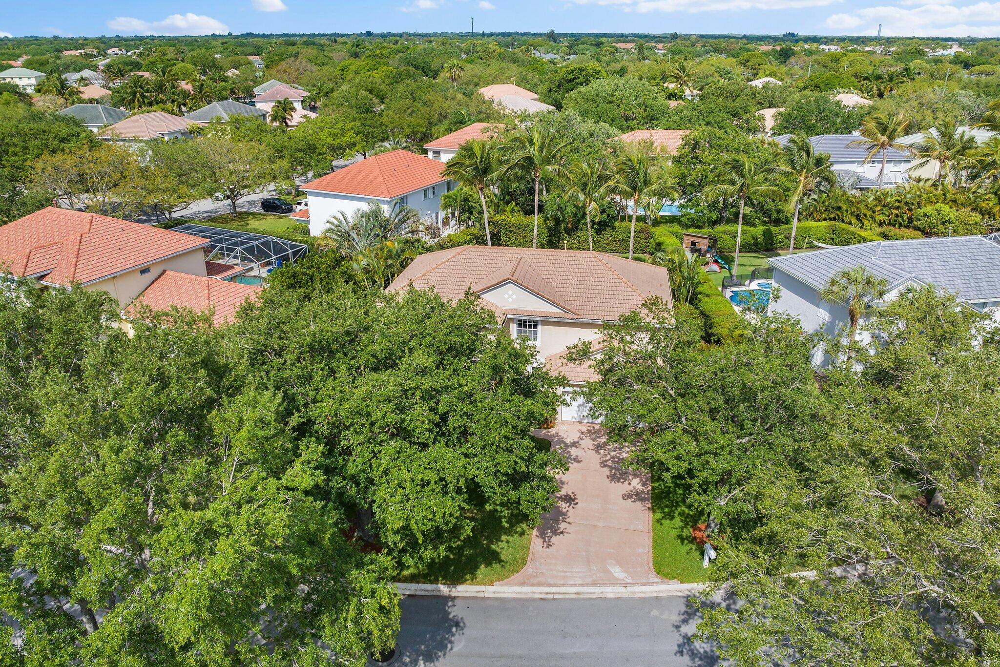 203 Anhinga Lane Jupiter, FL 33458 - Photo 54 of 63 an aerial view of residential houses with outdoor space and street view