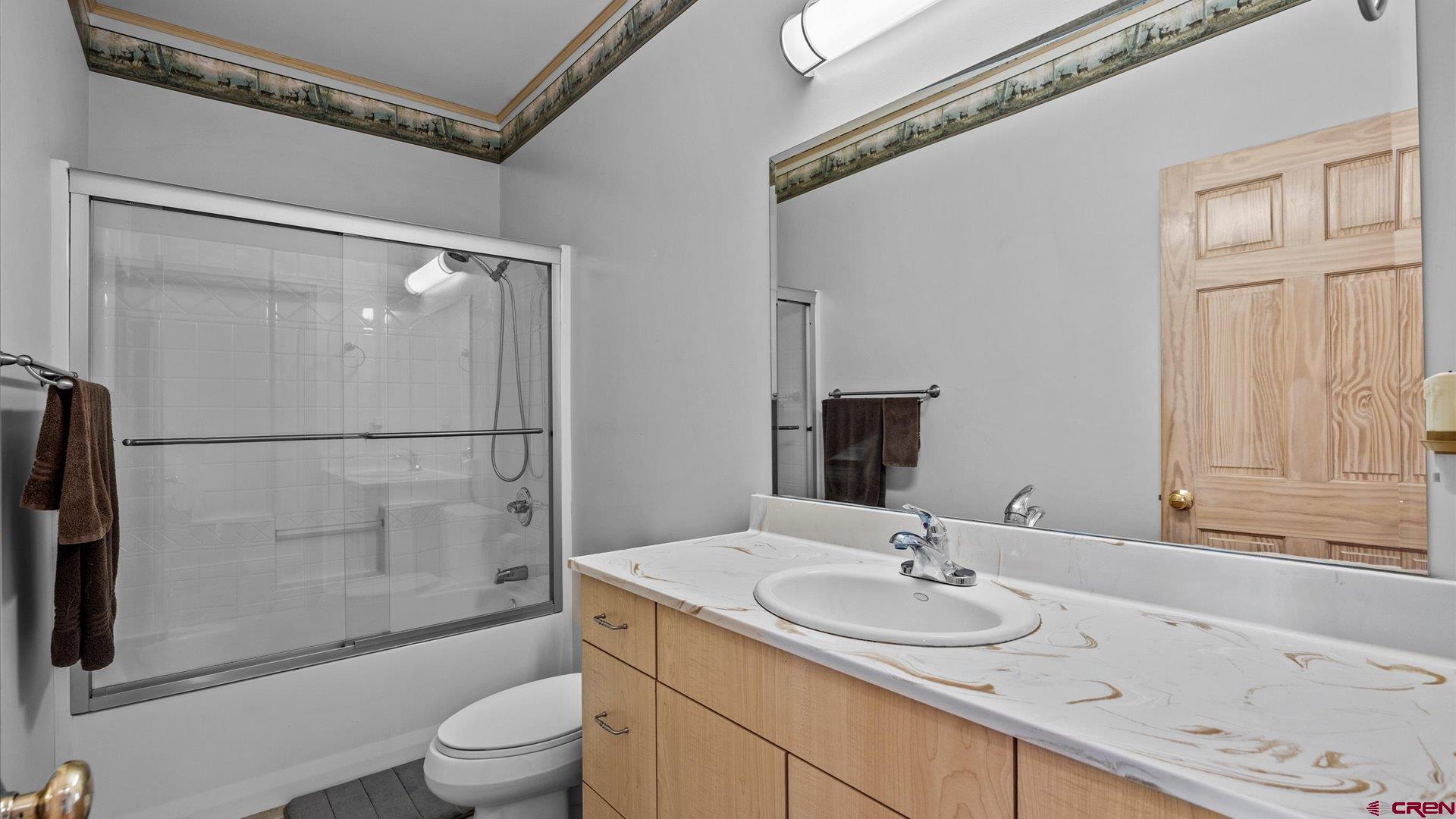 13232 B Road Delta, CO 81416 - Photo 12 of 26 a bathroom with a sink toilet and shower