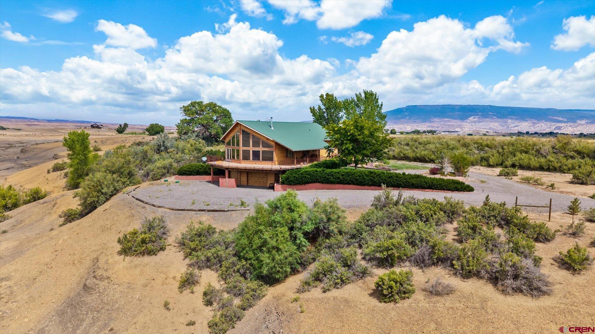 13232 B Road Delta, CO 81416 - Photo 18 of 26 a view of a garden with a house