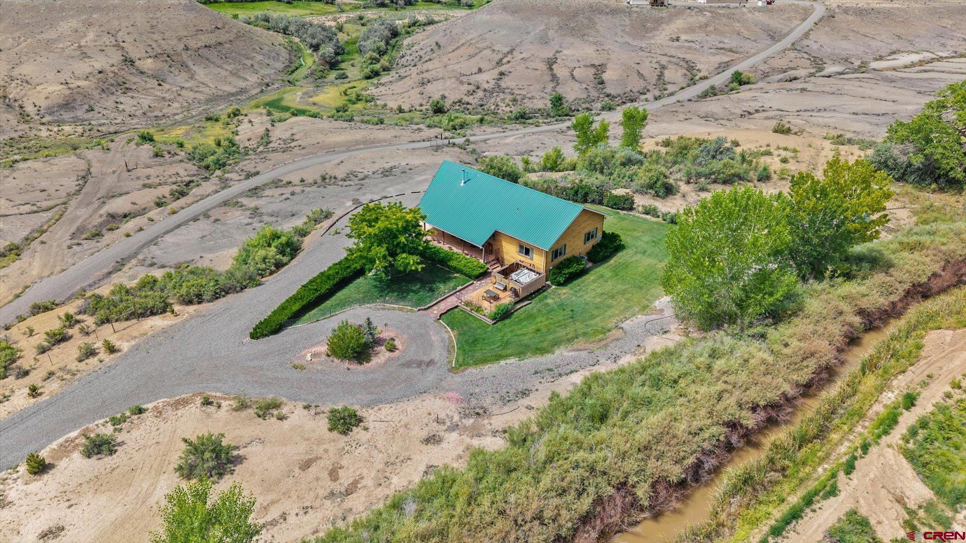 13232 B Road Delta, CO 81416 - Photo 20 of 26 an aerial view of a house with a yard