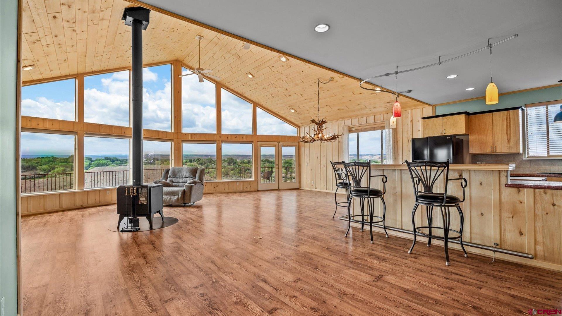 13232 B Road Delta, CO 81416 - Photo 4 of 26 a view of a kitchen with dining room and wooden floor