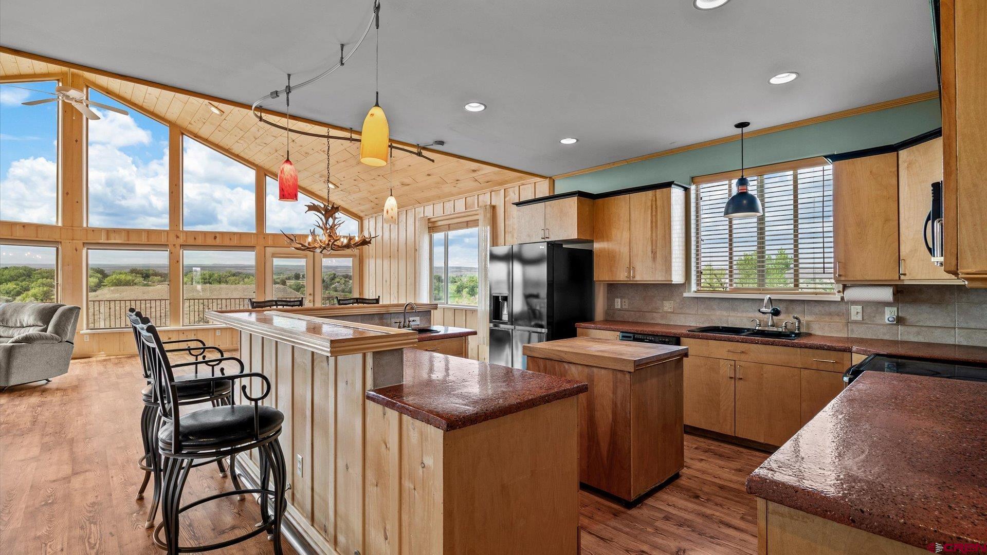 13232 B Road Delta, CO 81416 - Photo 5 of 26 a kitchen with lots of counter top space and dining table