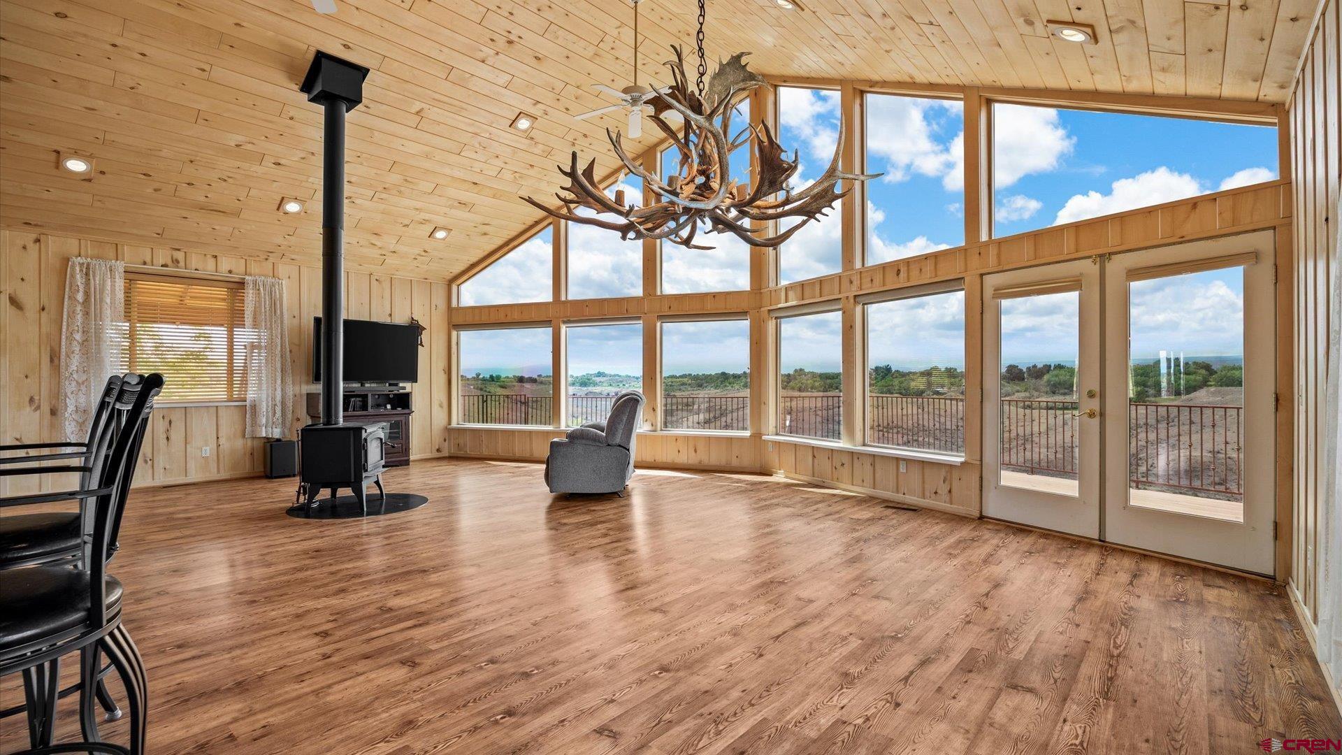 13232 B Road Delta, CO 81416 - Photo 8 of 26 a view of empty room with wooden floor and windows