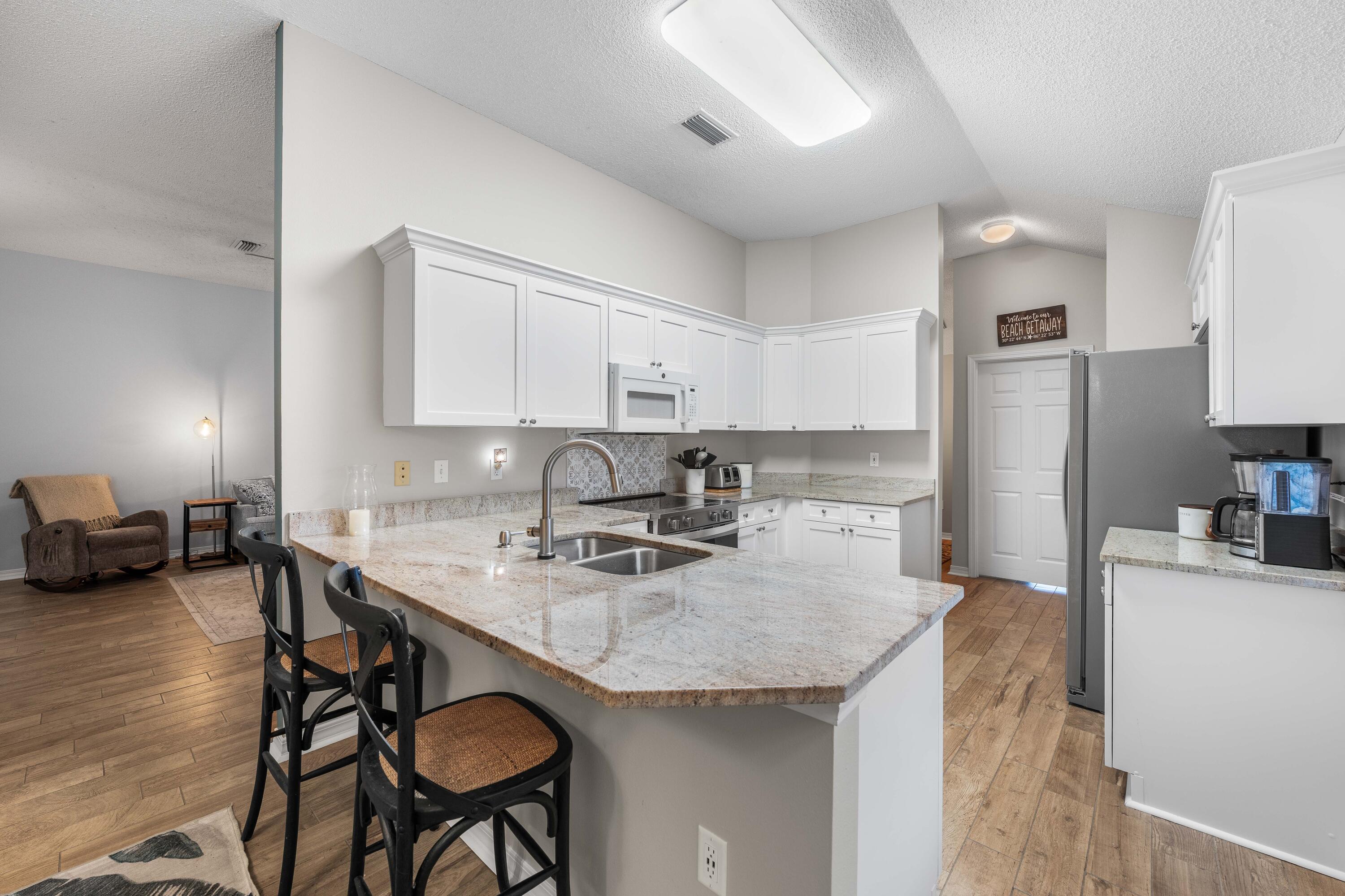 328 Bay Tree Drive Miramar Beach, FL 32550 - Photo 14 of 49 a kitchen with sink cabinets and appliances