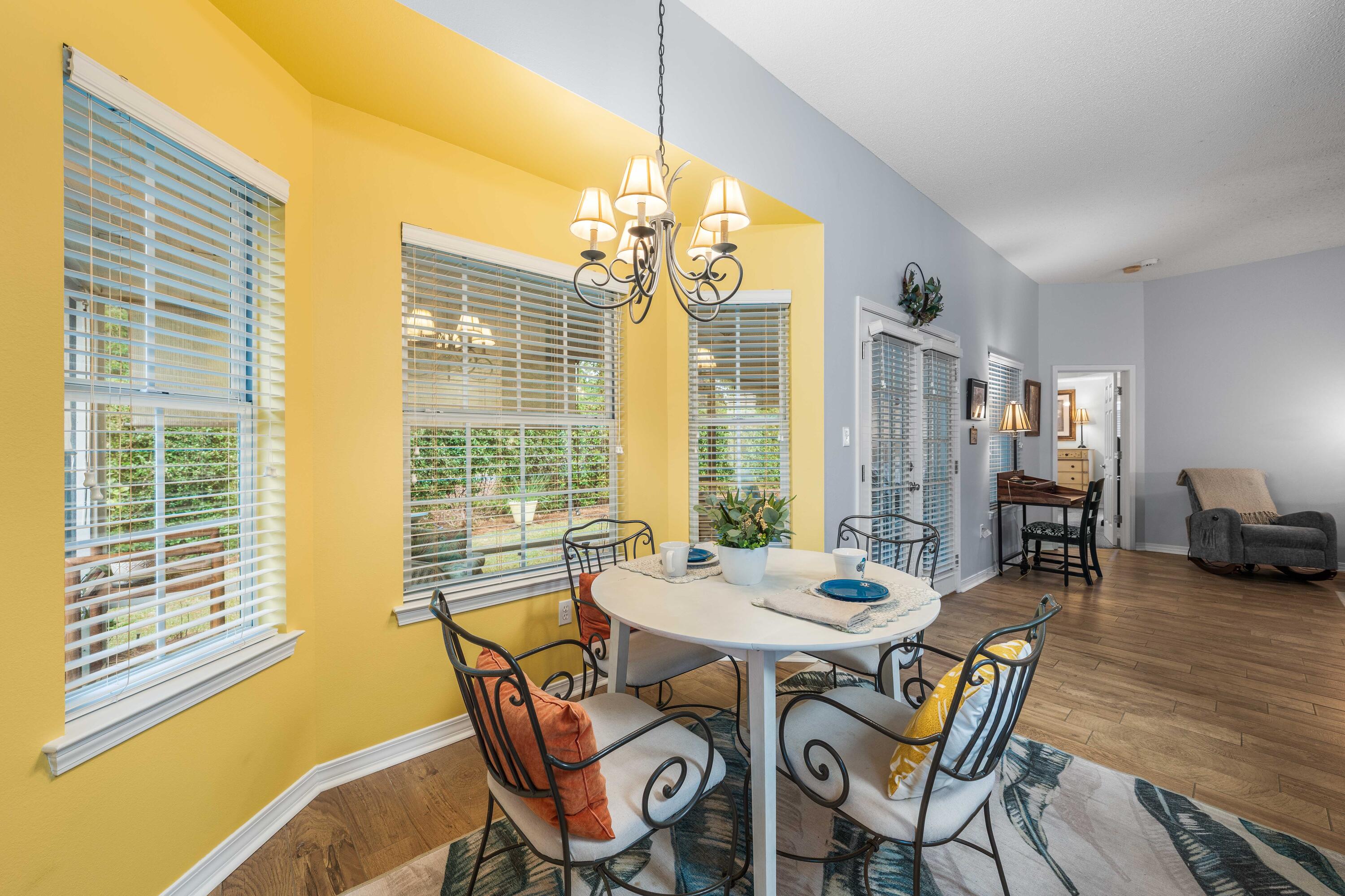 328 Bay Tree Drive Miramar Beach, FL 32550 - Photo 16 of 49 a view of a dining room with furniture and wooden floor