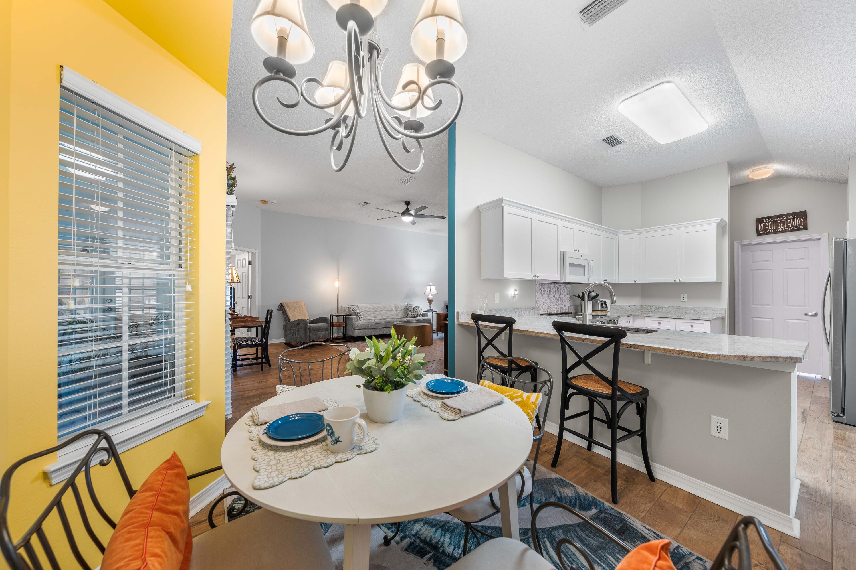 328 Bay Tree Drive Miramar Beach, FL 32550 - Photo 19 of 49 a kitchen with a table and chairs in it