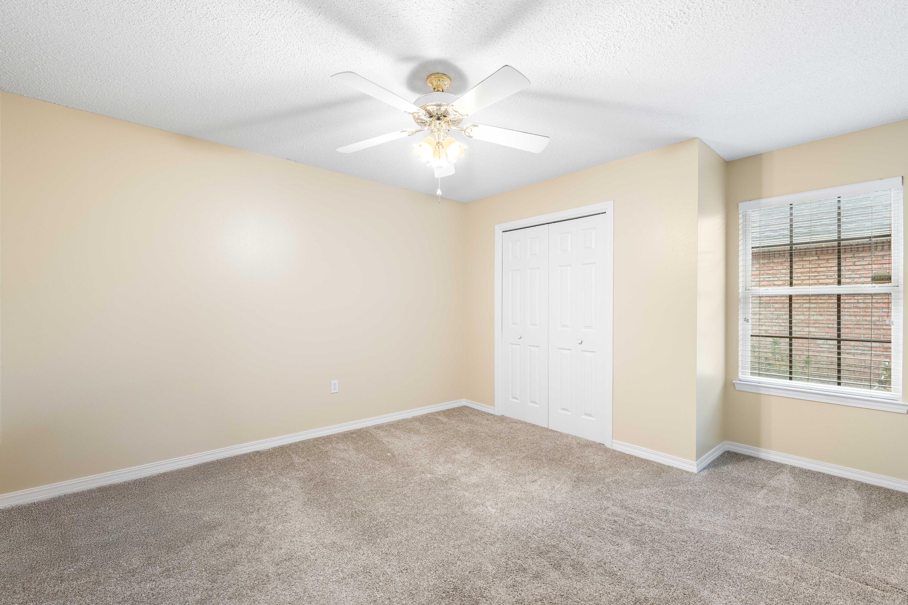 328 Bay Tree Drive Miramar Beach, FL 32550 - Photo 28 of 49 an empty room with windows and fan