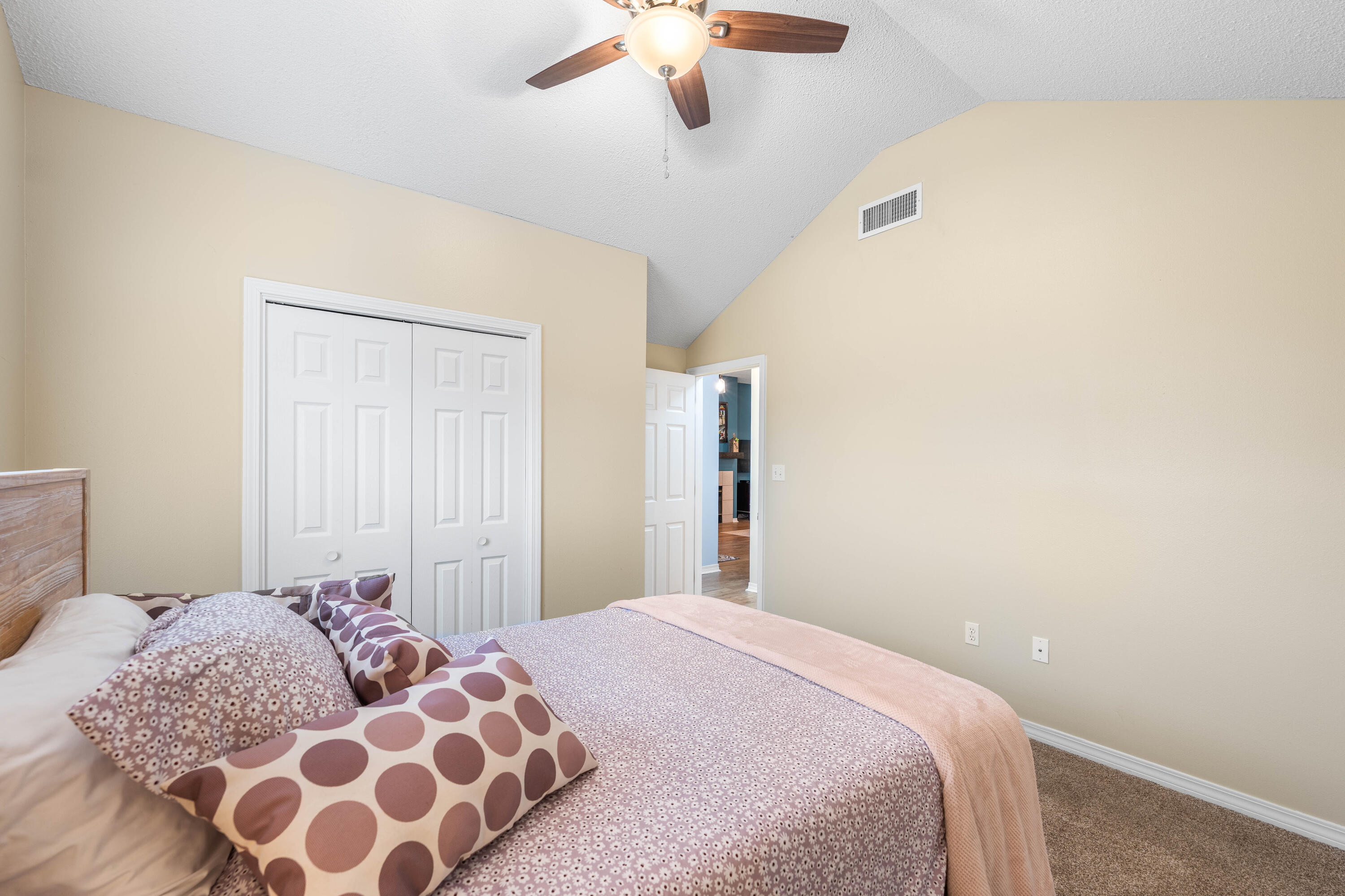 328 Bay Tree Drive Miramar Beach, FL 32550 - Photo 32 of 49 a bedroom with a large bed and a chandelier fan