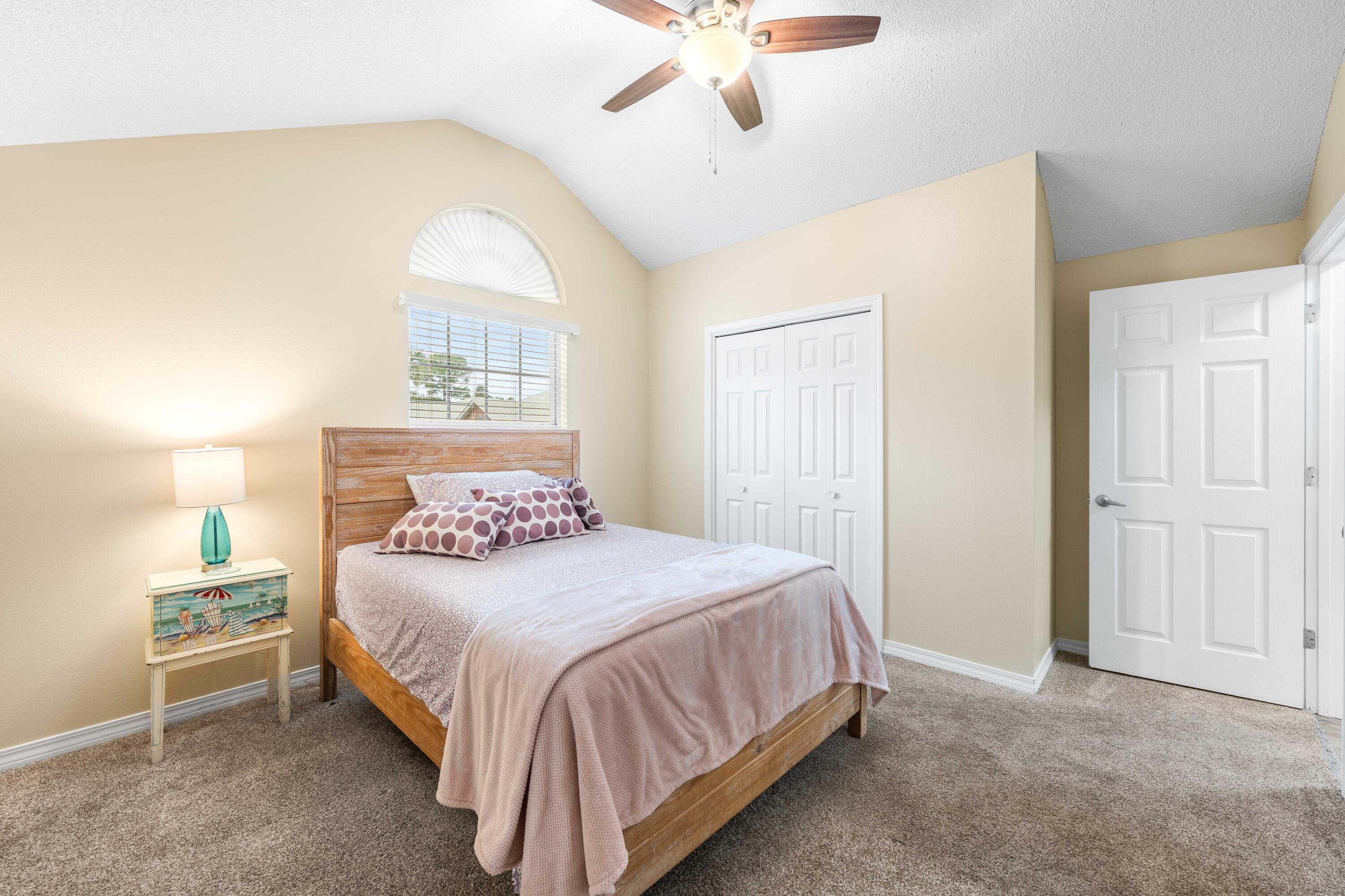 328 Bay Tree Drive Miramar Beach, FL 32550 - Photo 33 of 49 a bedroom with a bed and a chandelier