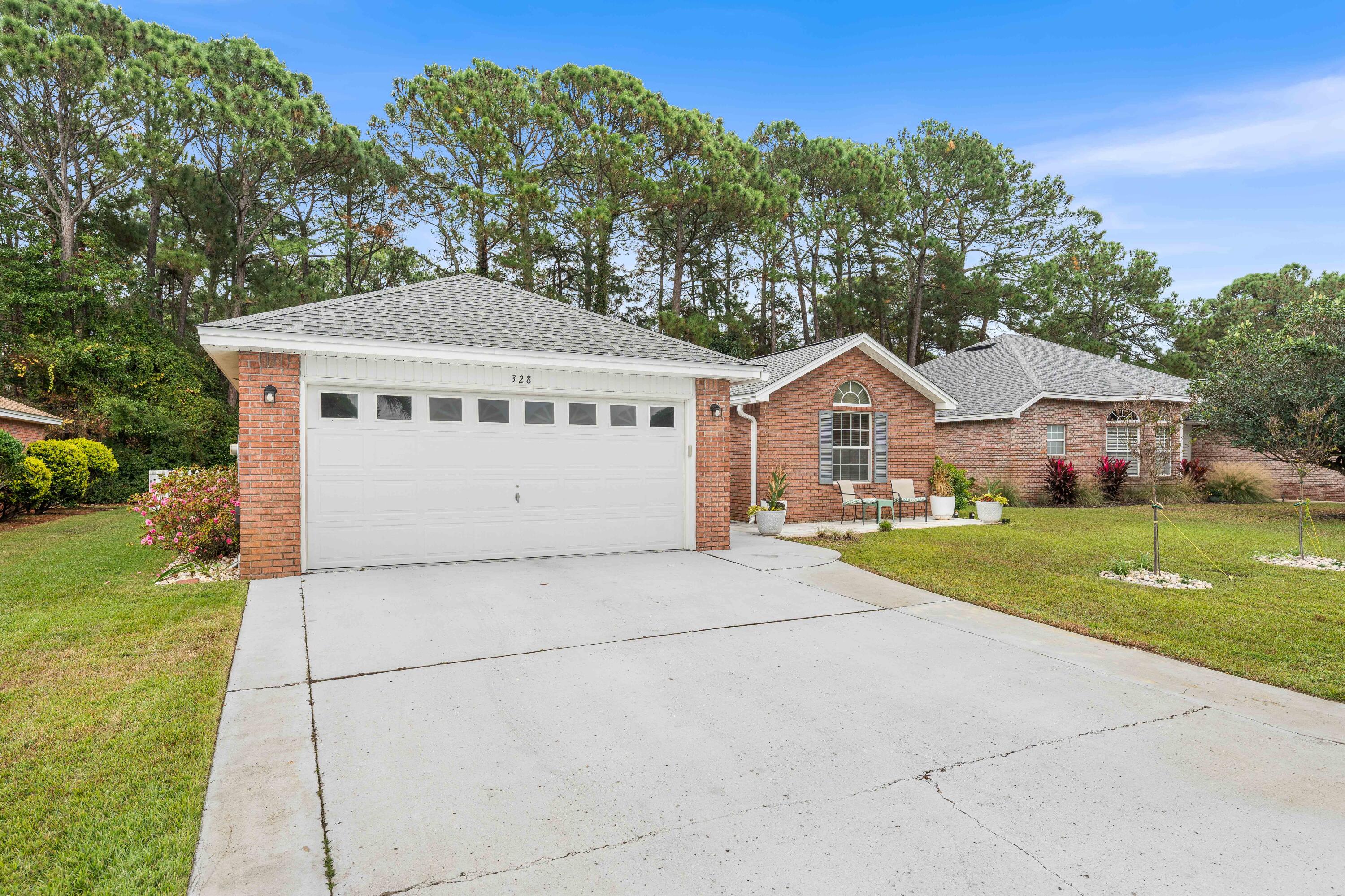 328 Bay Tree Drive Miramar Beach, FL 32550 - Photo 39 of 49 a front view of a house with garden