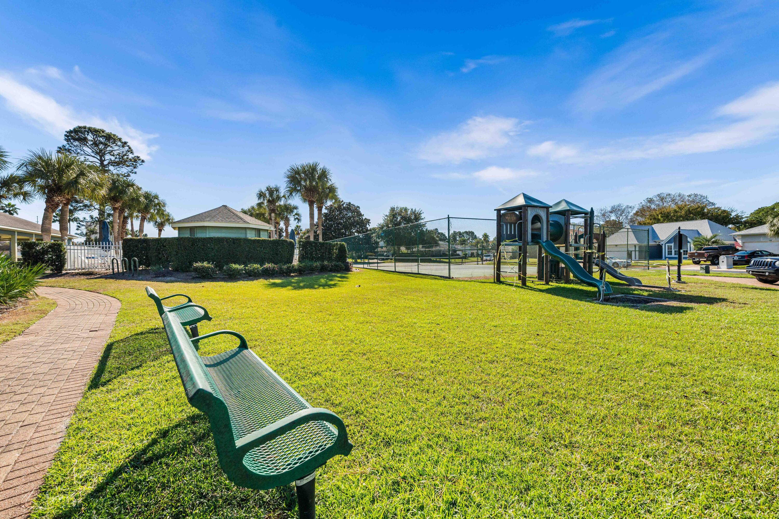 328 Bay Tree Drive Miramar Beach, FL 32550 - Photo 40 of 49 a view of a swimming pool with a garden and trees