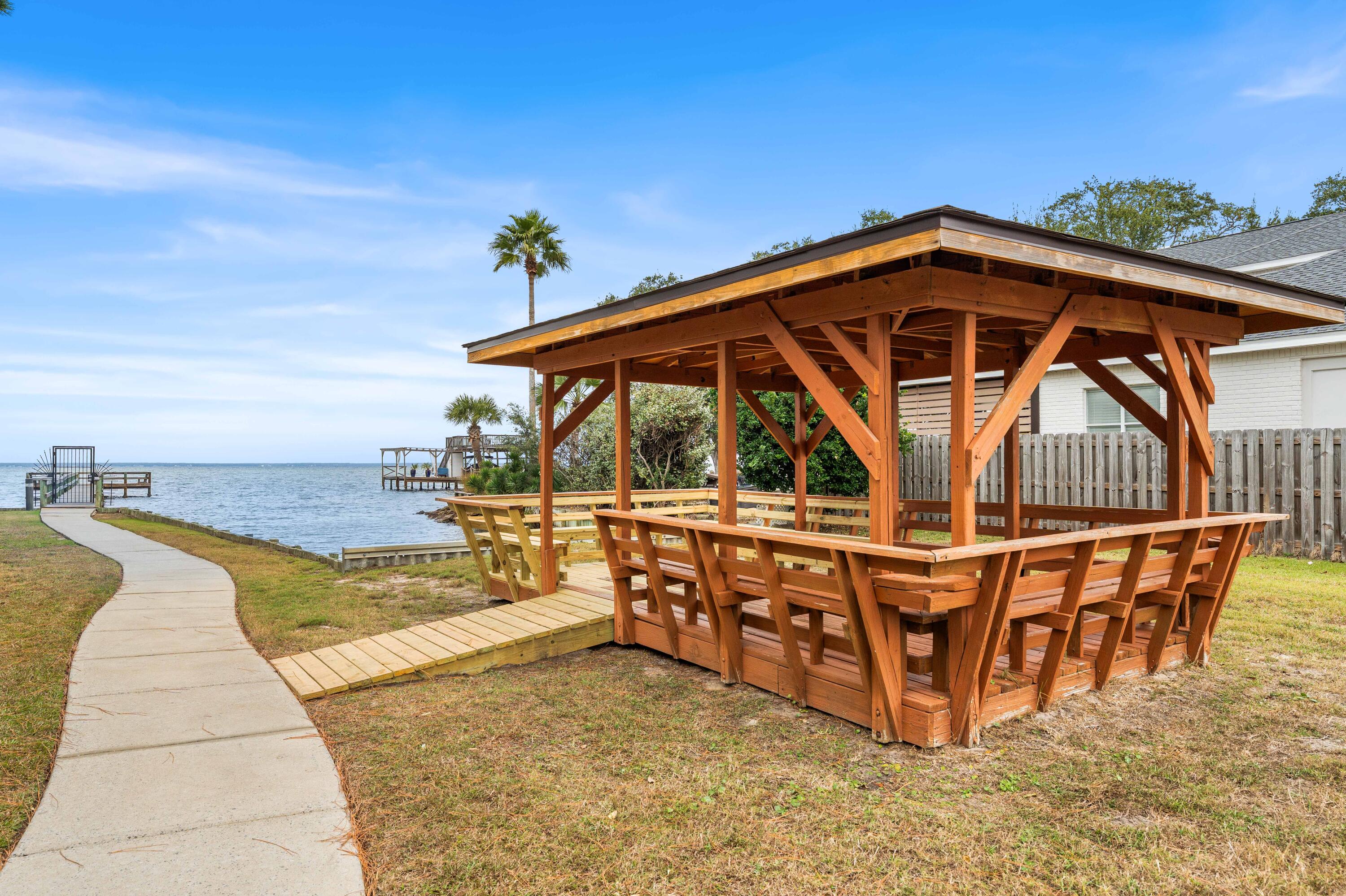 328 Bay Tree Drive Miramar Beach, FL 32550 - Photo 48 of 49 a view of a roof deck with dining table and chairs