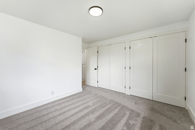 871 Bonita Way Centerville, UT 84014 - Photo 38 of 61 Room featuring neutral gray carpeting and white painted walls